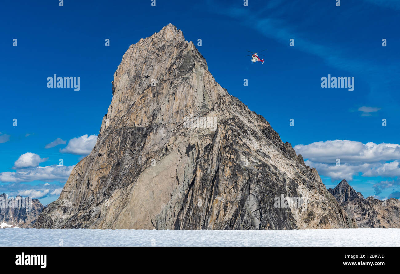 Life flight searches by Bugaboo Spire in the  Bugaboo Provincial Park Stock Photo