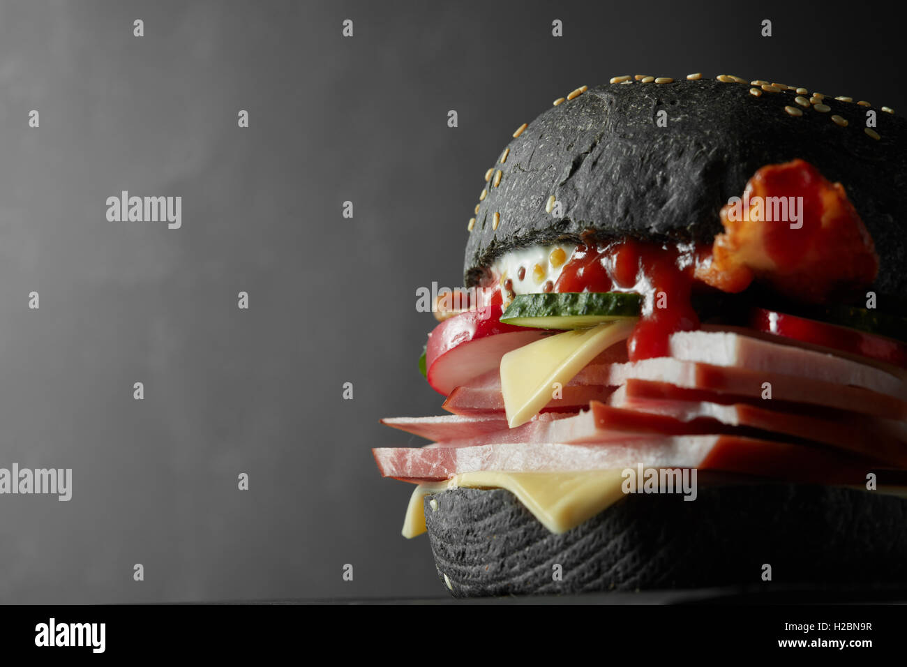 Japanese Black Burger with Cheese. Cheeseburger from Japan with black