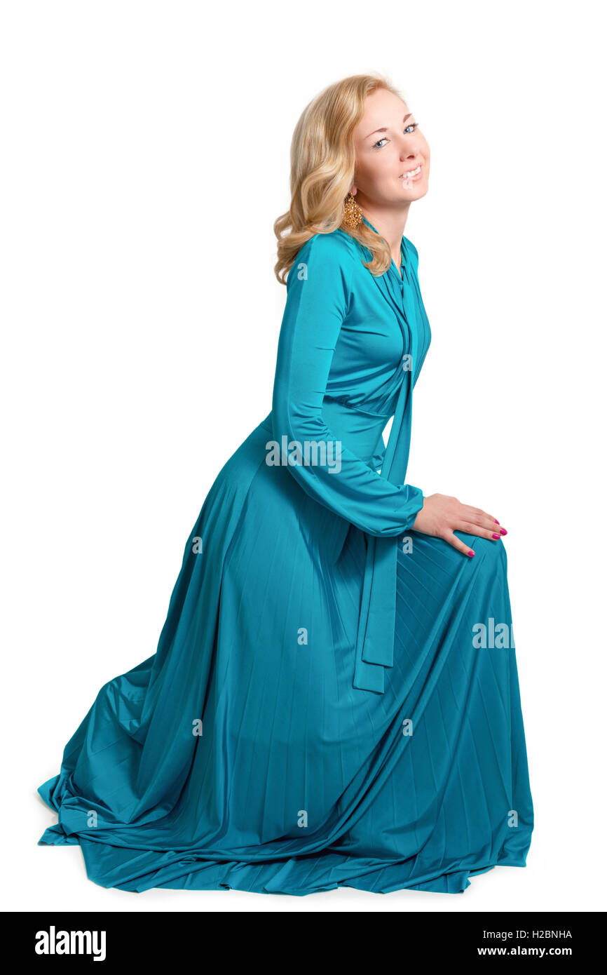 Portrait of a beautiful blonde woman in blue long dress Stock Photo - Alamy