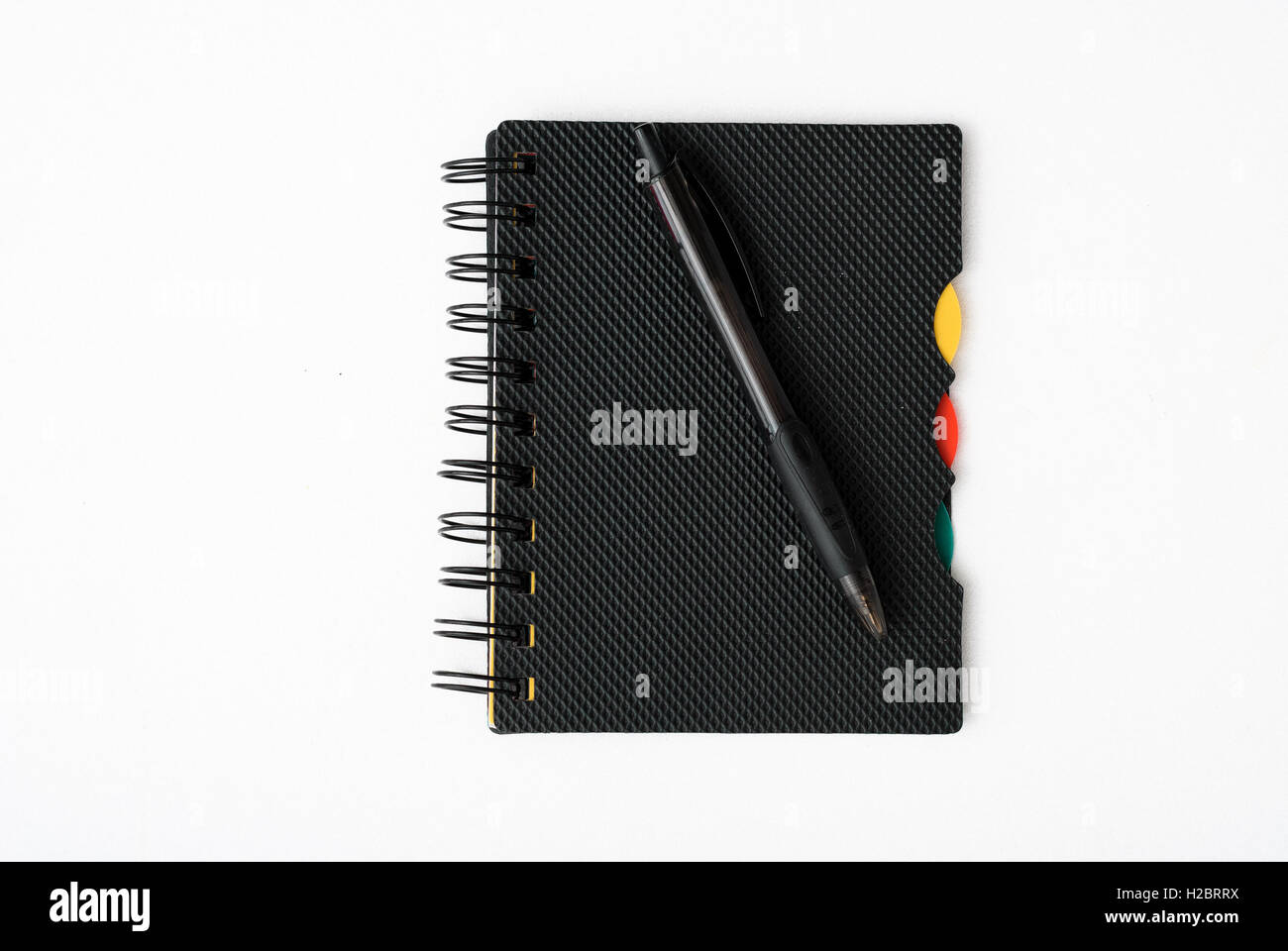 notepad with pen isolated Stock Photo - Alamy