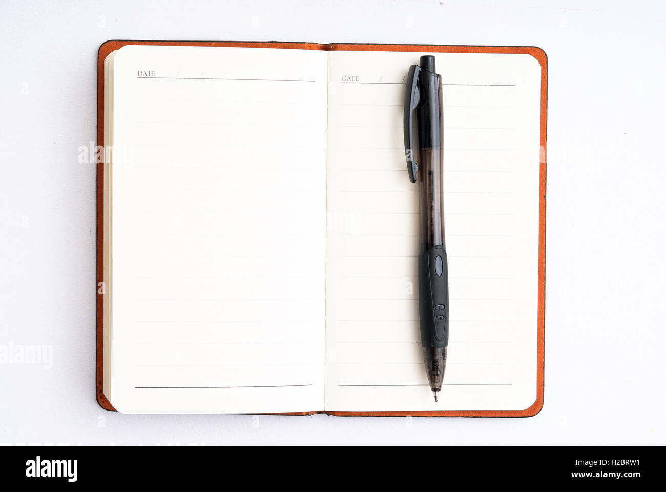 notepad with pen isolated Stock Photo Alamy