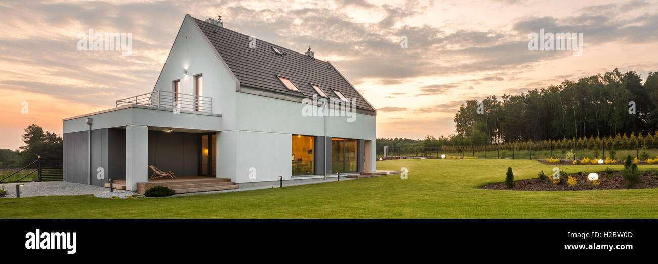 New Style White Villa With Big Backyard Outdoor View Stock Photo