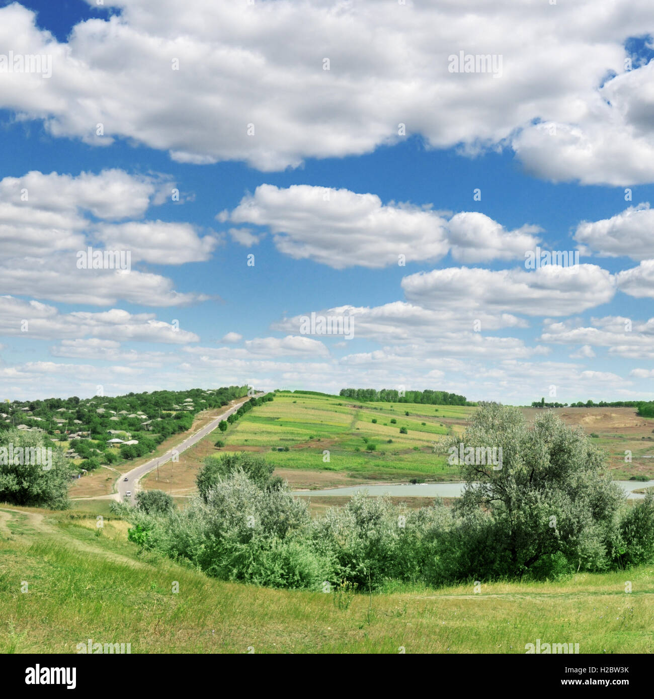 Highway on field and blue sky Stock Photo