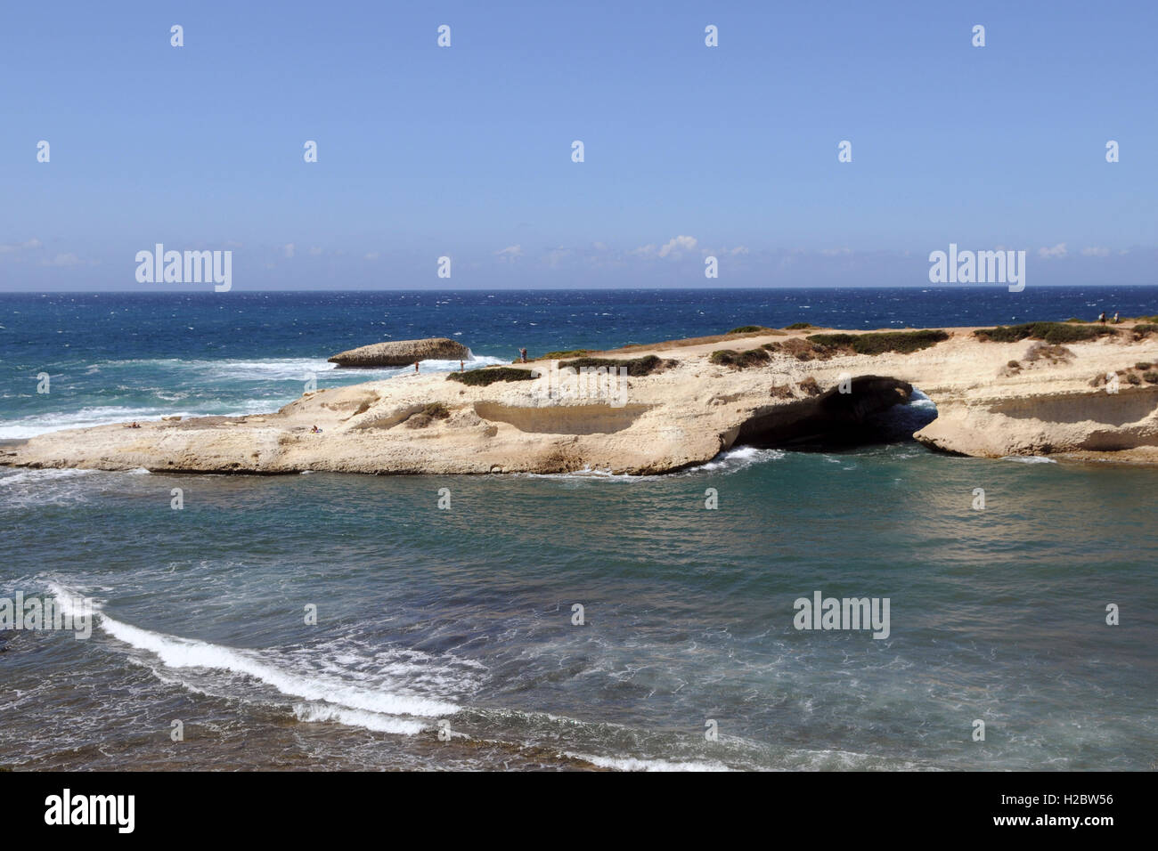 Hollowed-out limestone arch, S'Archittu, Oristano Province, Sardinia ...