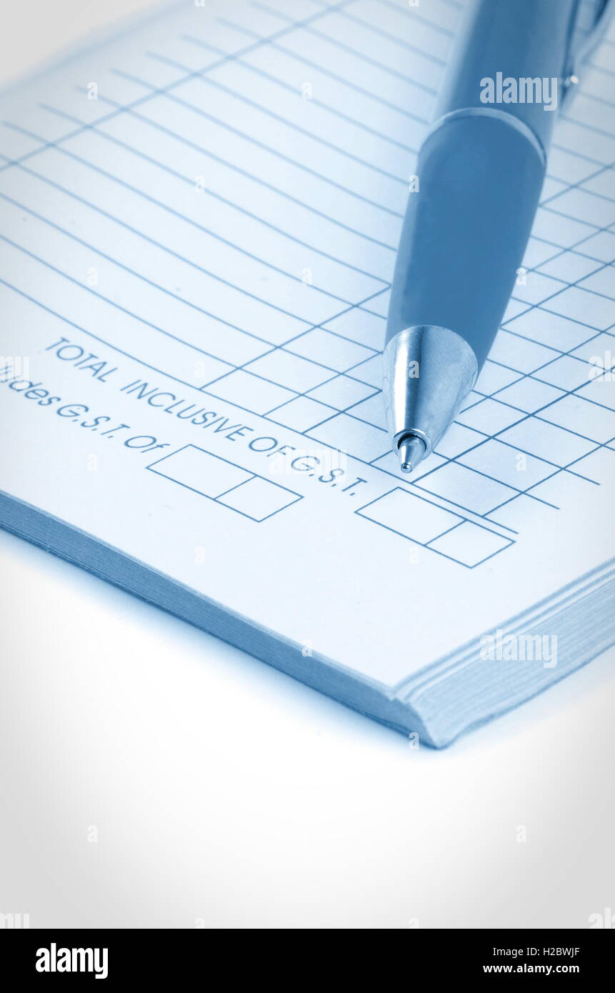 tax invoice book with pen Stock Photo Alamy