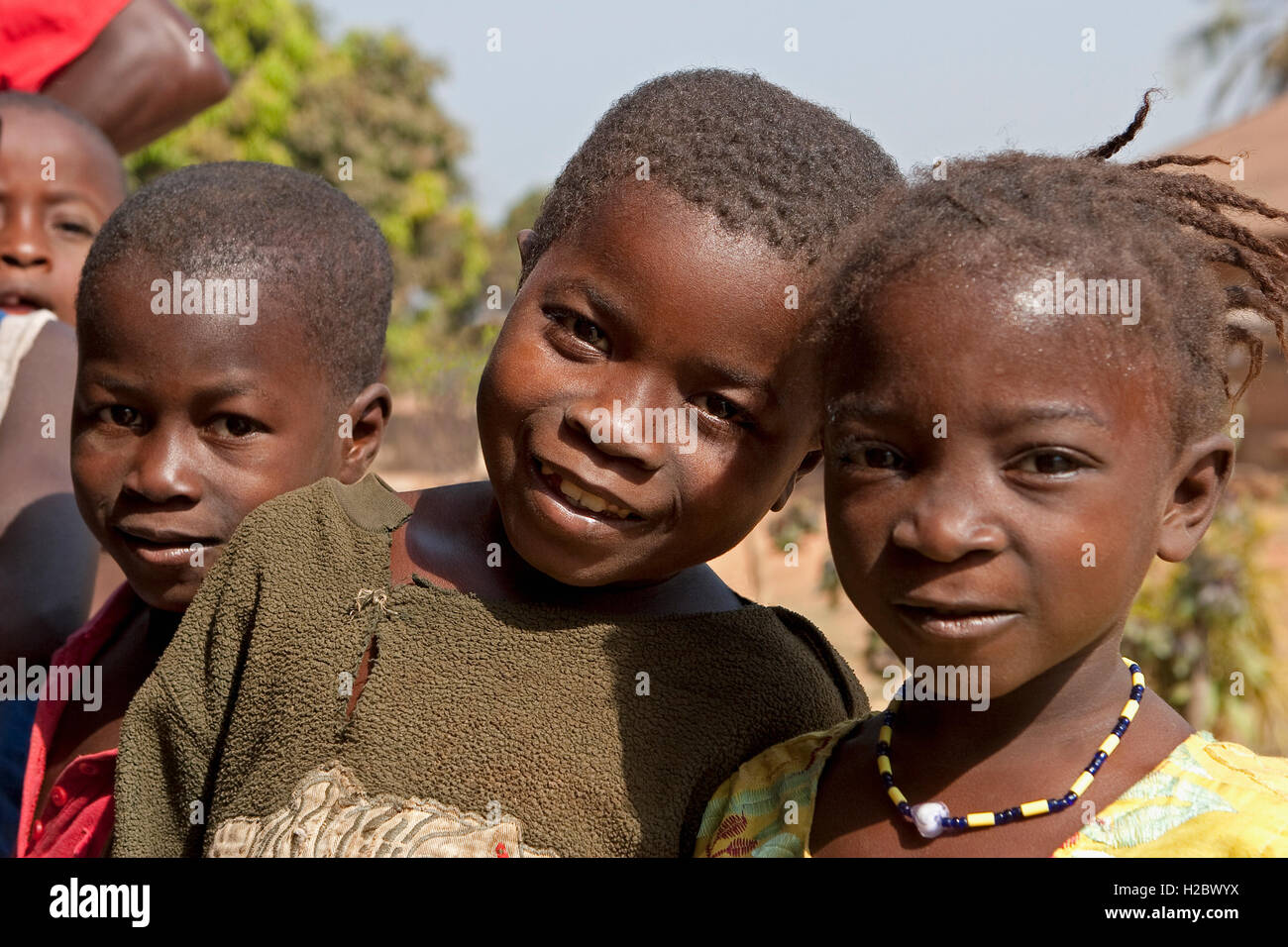 Group of disadvantaged very young local village African children from north Sierra Leone, who do not attend school as education is not free. Stock Photo