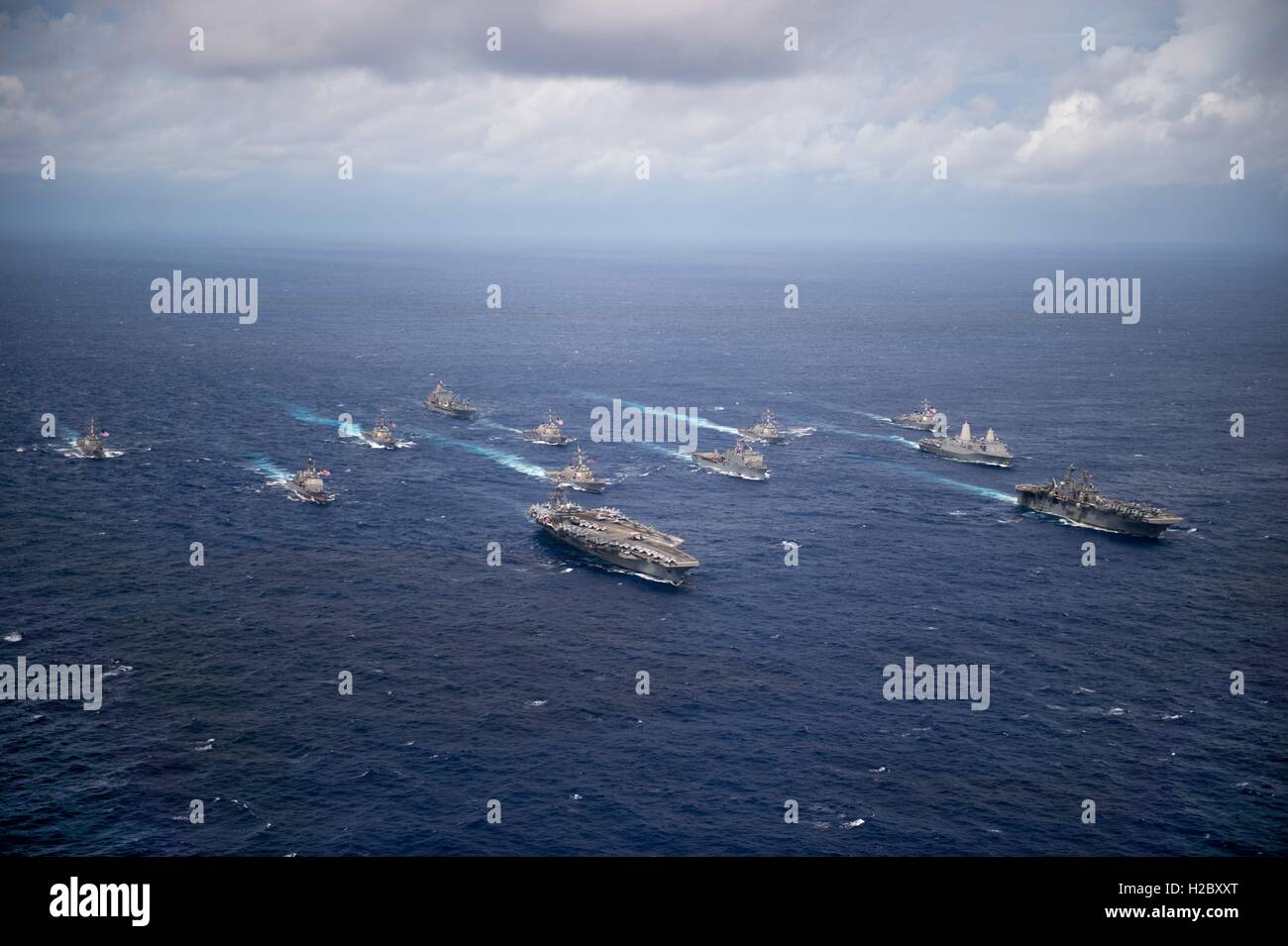 US Navy ships steam in formation during Valiant Shield exercises September 23, 2016 in the Philippine Sea. Stock Photo