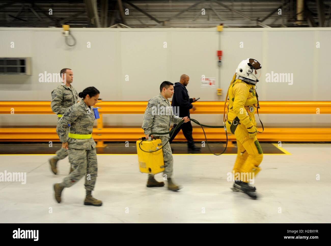 U.S. Air Force soldiers escort a pilot wearing a high-altitude pressure suit to his U-2 aircraft at Joint Base Andrews September 19, 2015 in Prince Georges County, Maryland. Stock Photo