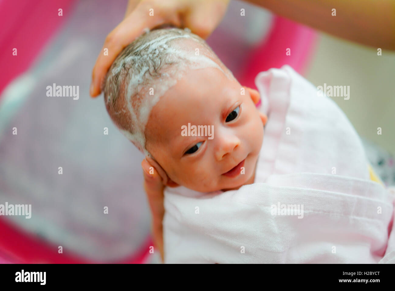 washing newborn hair