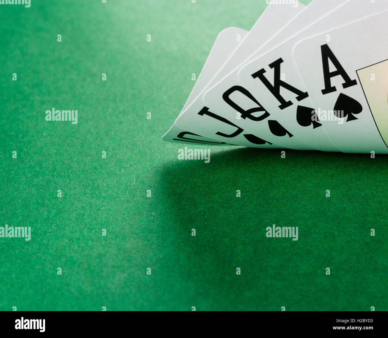 Playing cards showing a wining hand of poker - Royal Flush Stock Photo