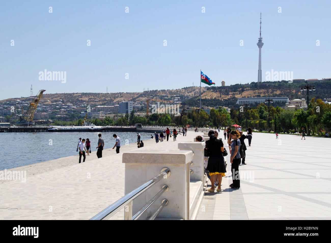 Azerbaijan, Baku. Baku Boulevard is a promenade that runs parallel to Baku's seafront. Baku TV Tower in the background, the tallest building in the country, 310 metres. Stock Photo