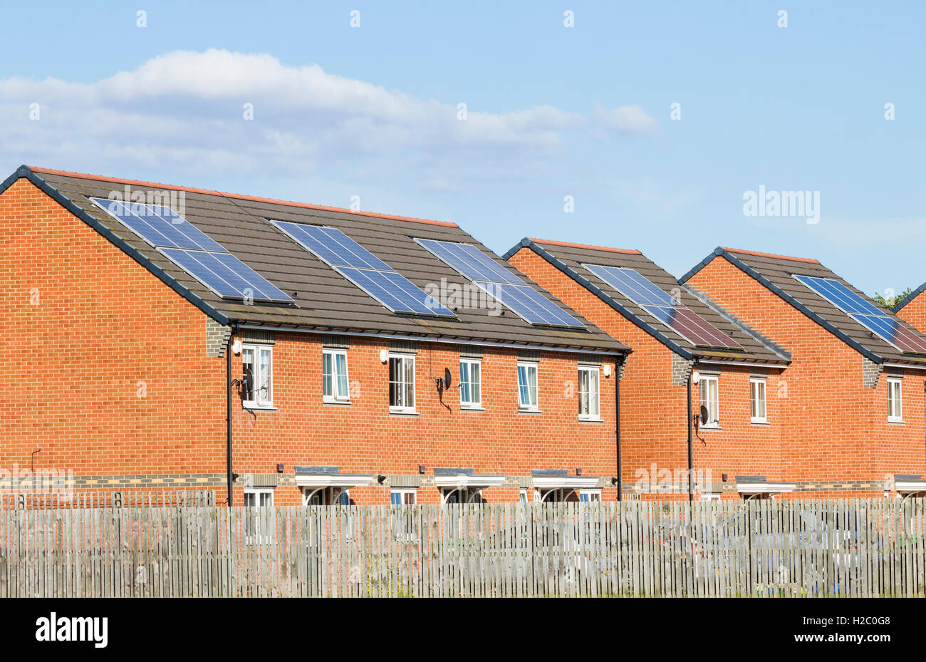 Solar panels on roofs of houses in England. UK Stock Photo