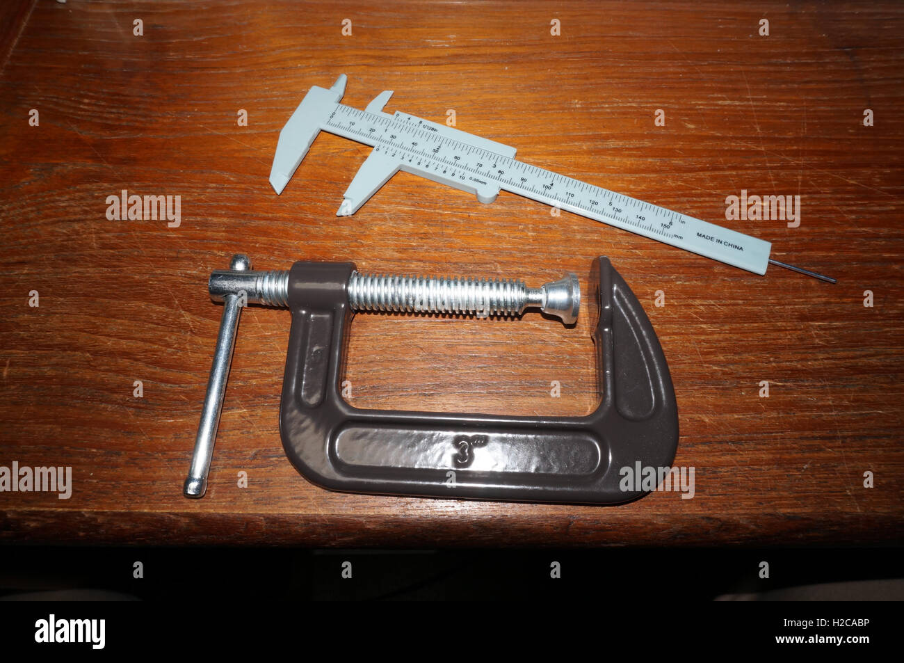 A pair of tools on a wooden bench Stock Photo