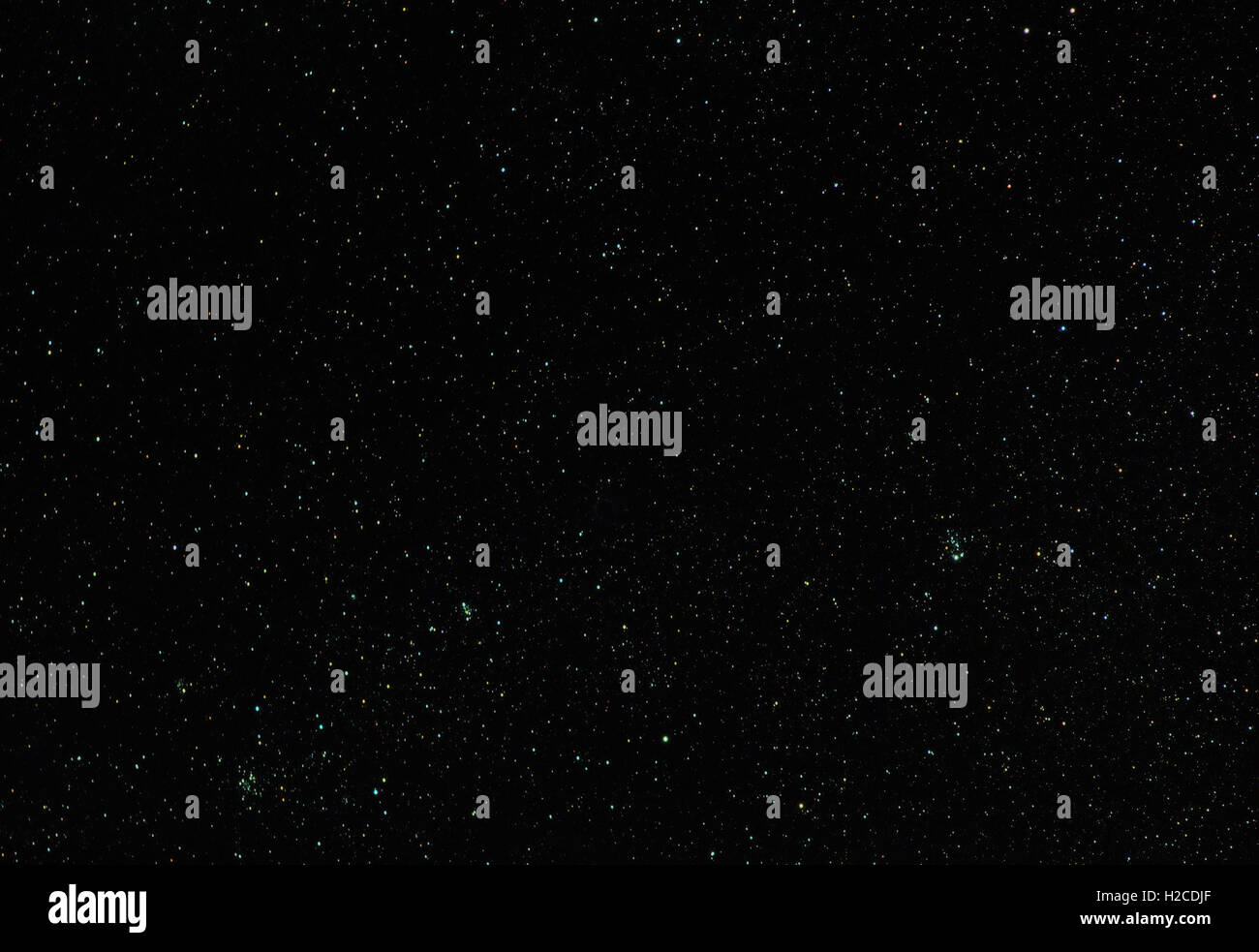 Abstract astronomy space universe background: black night sky with stars. Can be used as a wallpaper or backdrop. Stock Photo
