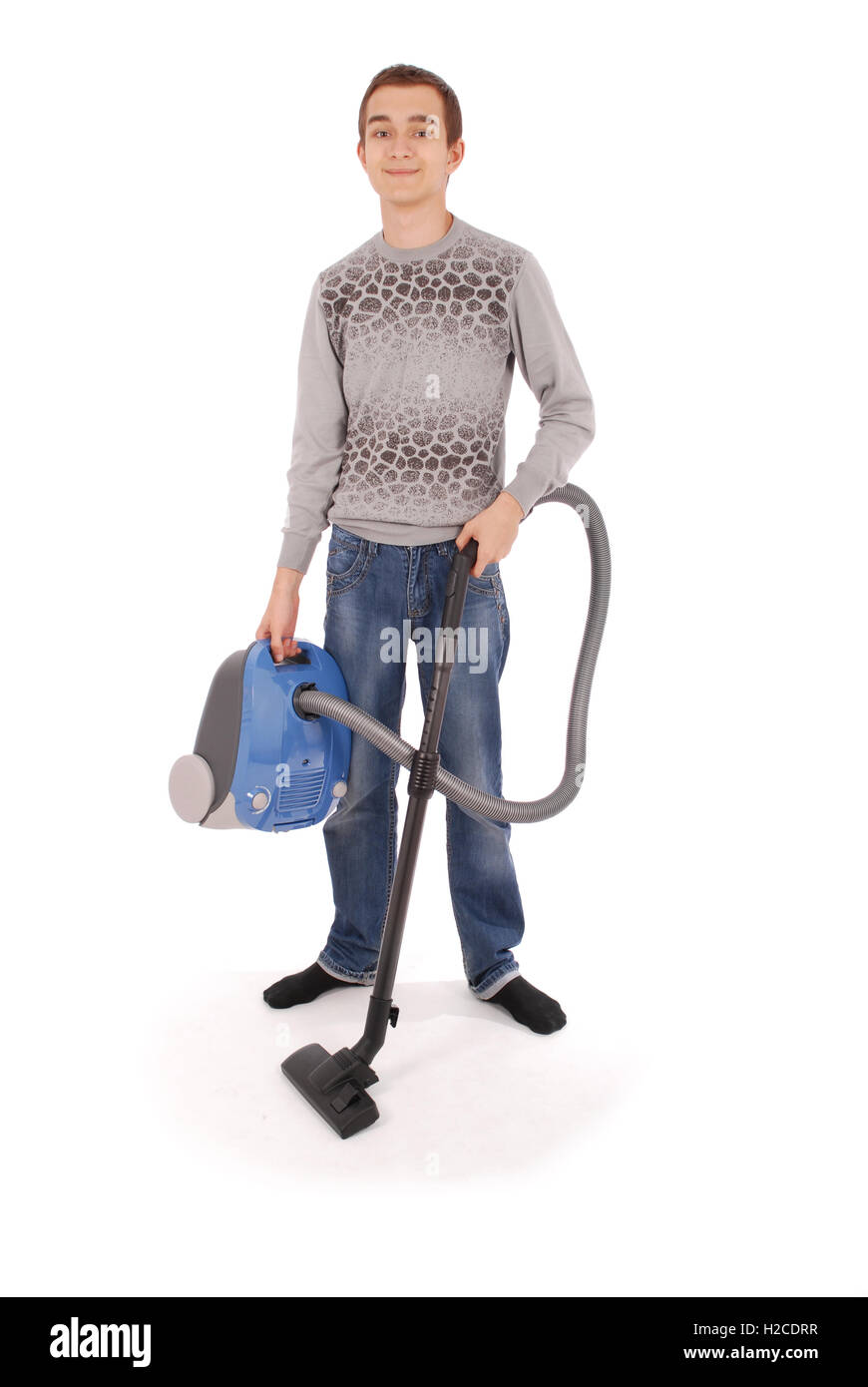 Boy with vacuum cleaner isolated on white background Stock Photo Alamy
