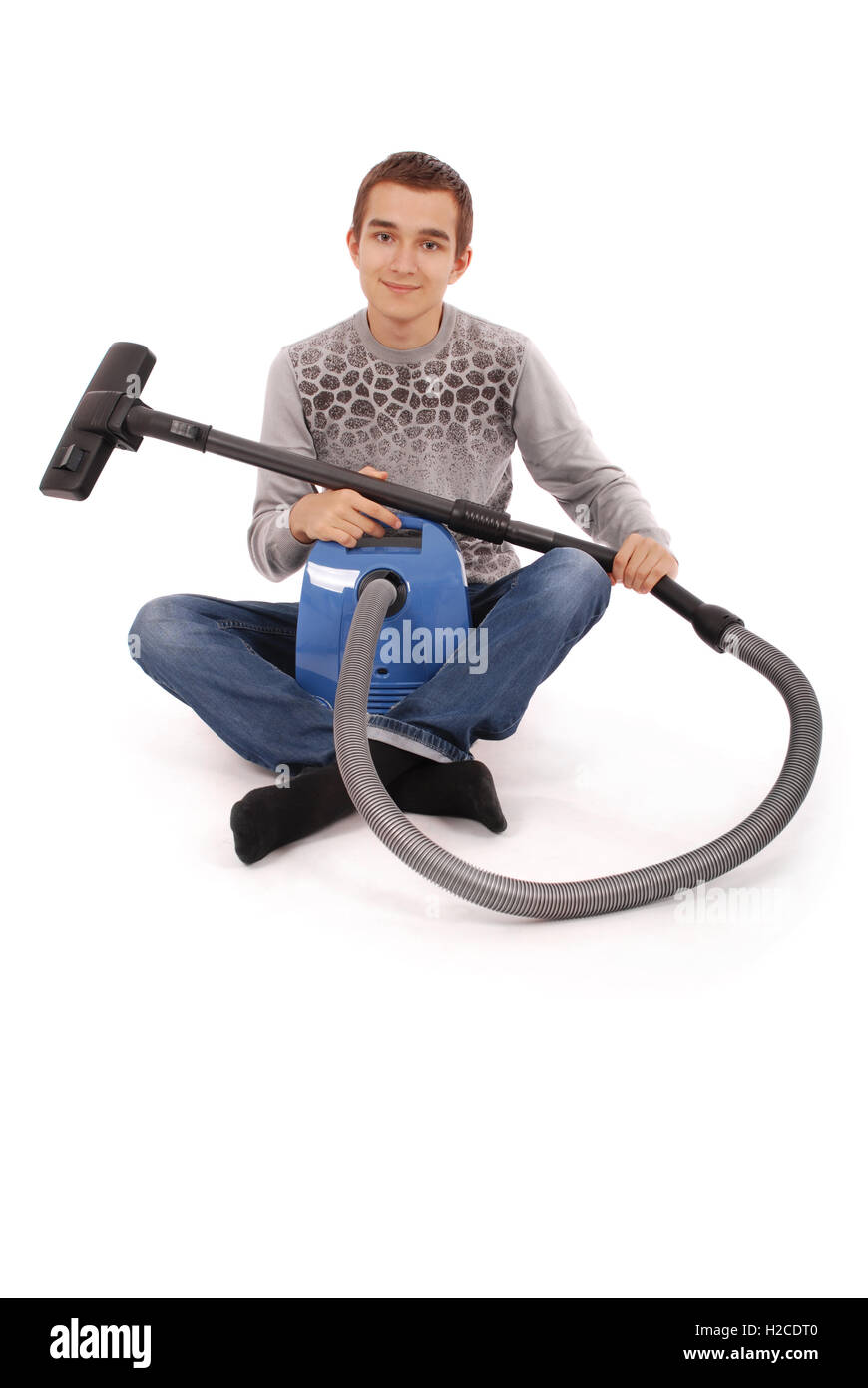 Boy with vacuum cleaner isolated on white background Stock Photo Alamy