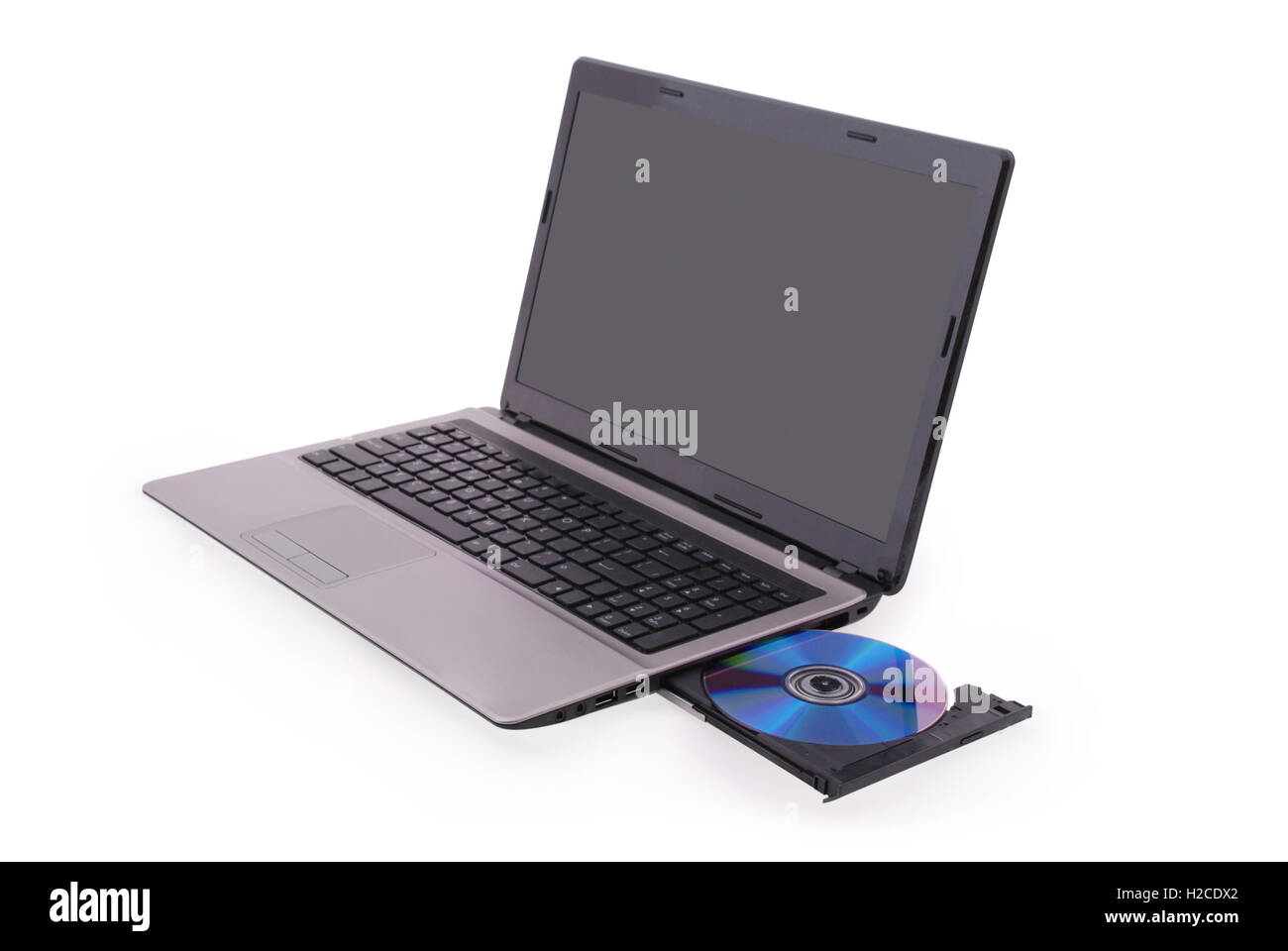 Laptop with CD isolated on white background. Photo with clipping path Stock Photo