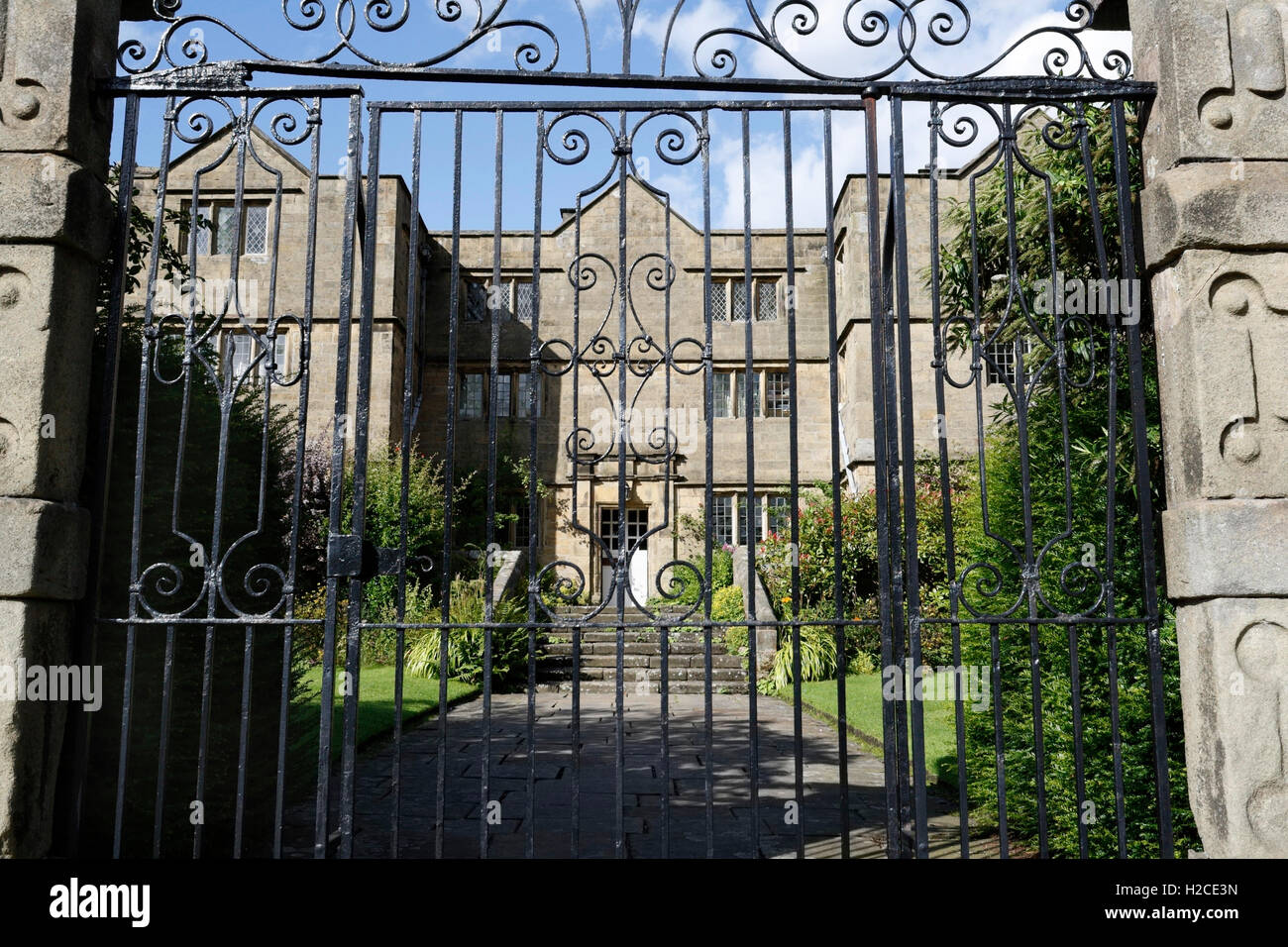 Outside Eyam Hall Derbyshire Peak District National Park England UK, Jacobian architecture, historic manor house, listed building, closed metal gate Stock Photo