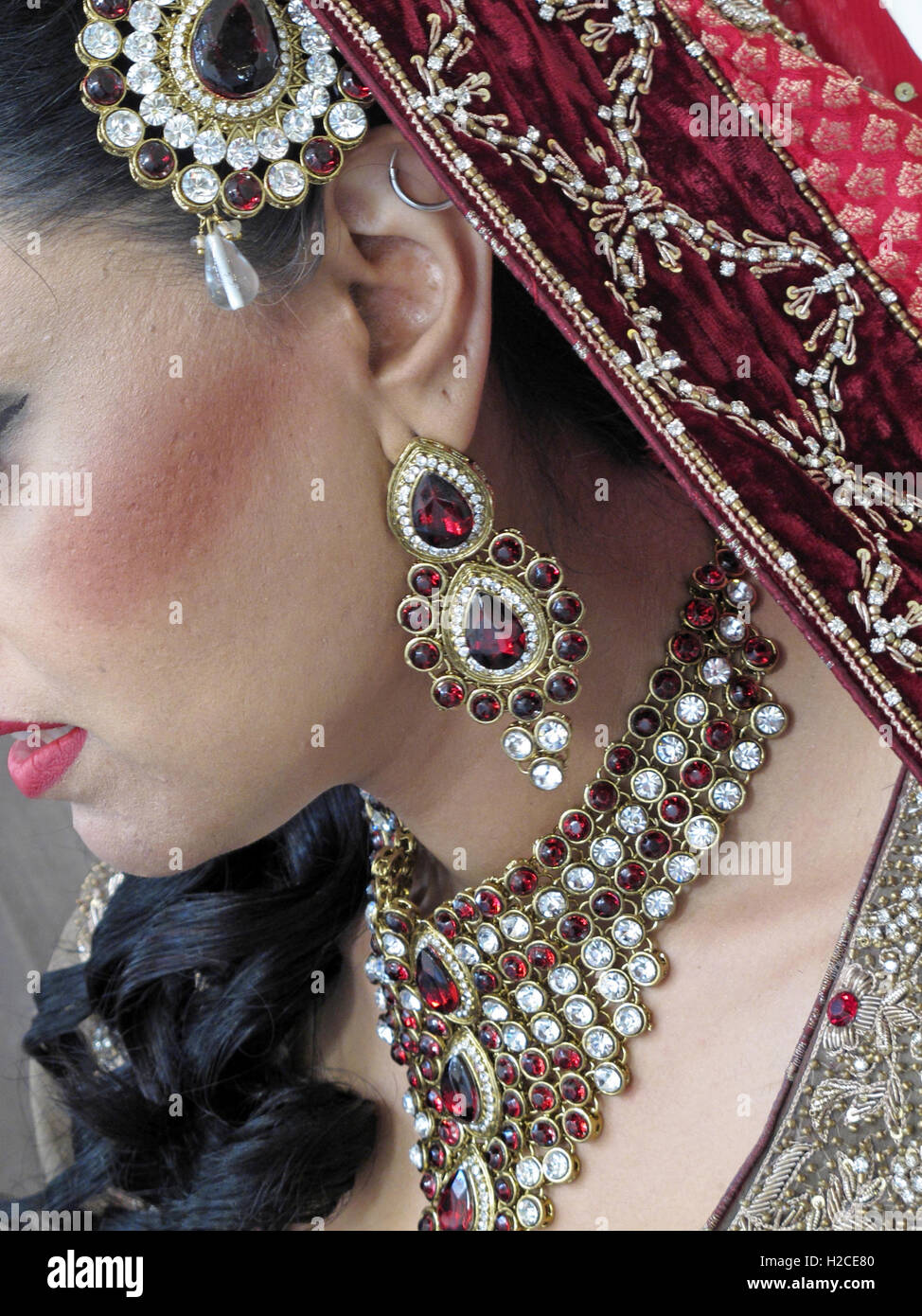Asian wedding hands and jewelery, henna and gold Stock Photo