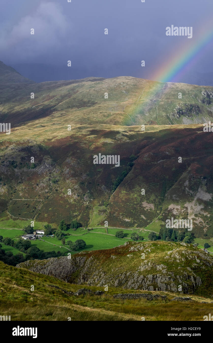 Rainbow over Deepdale Hall, Patterdale, Lake District Stock Photo