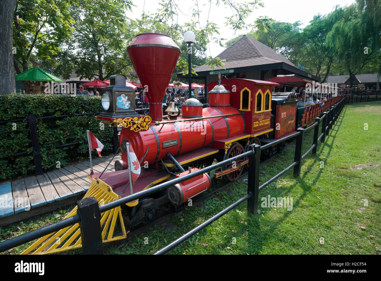 The well-known Centreville miniature train ride at Centreville amusement park on the Toronto Island park. Toronto Ontario Canada Stock Photo