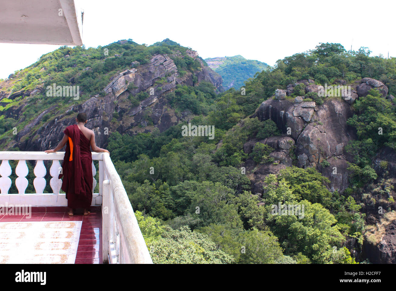 Buddhist Monk Alone at Mountain Temple Stock Photo