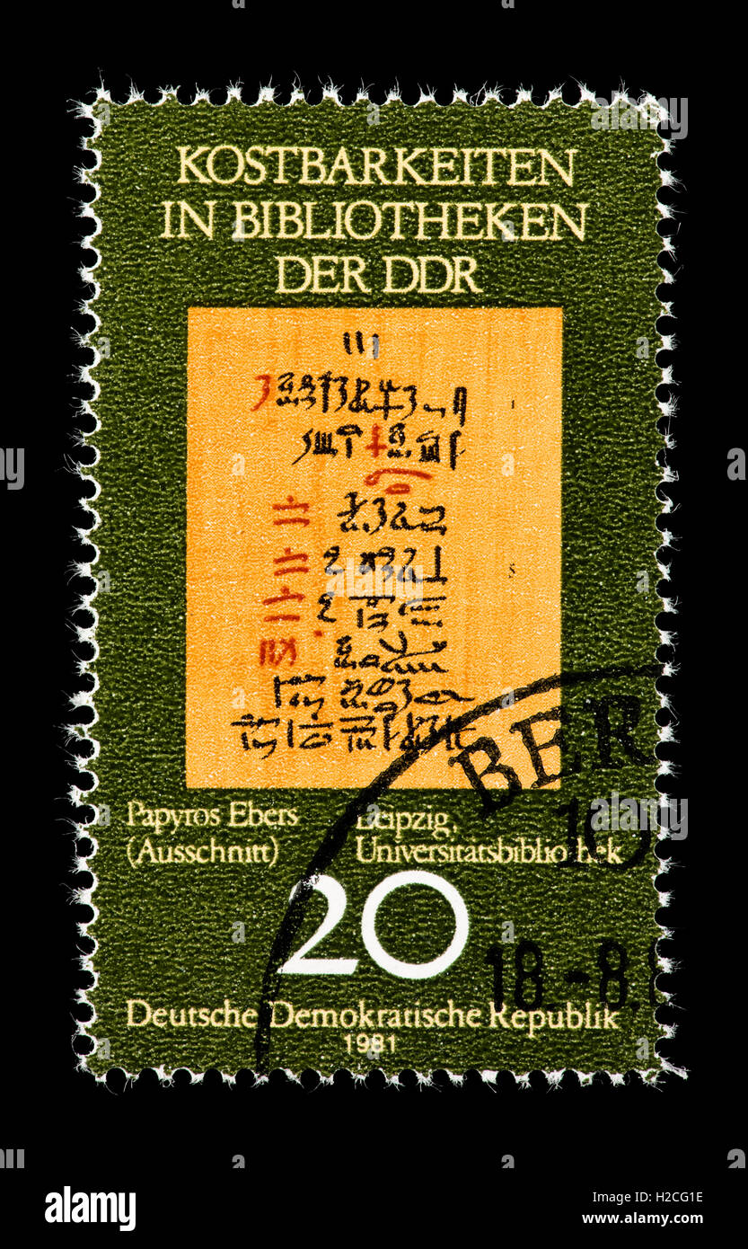 Postage stamp from East Germany (DDR) depicting the Ebers Papyrus (Egyptian medical ancient text), circa 1600 BC, in Leipzig. Stock Photo