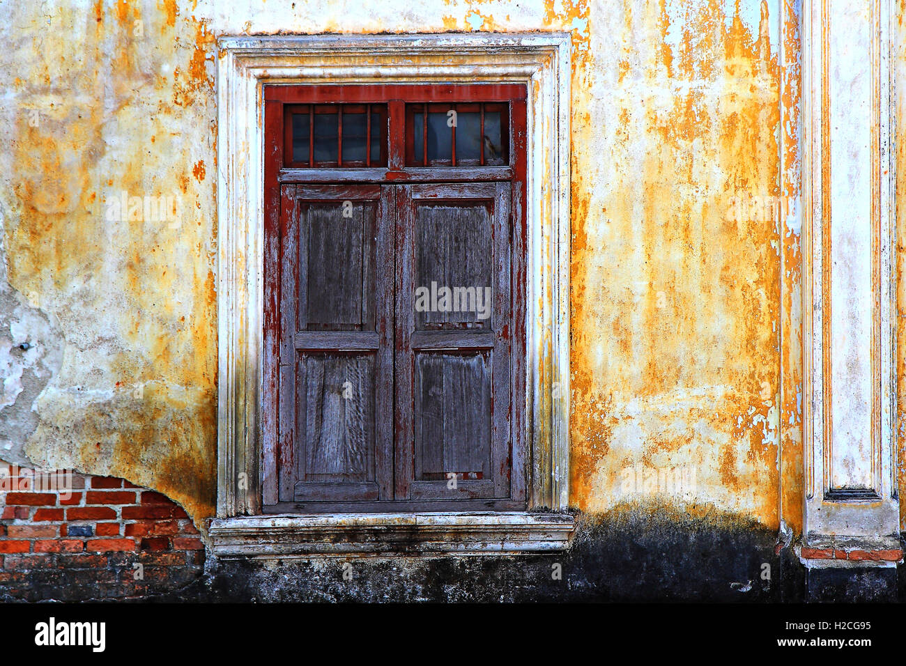 Old vintage wooden window on yellow wall Stock Photo - Alamy