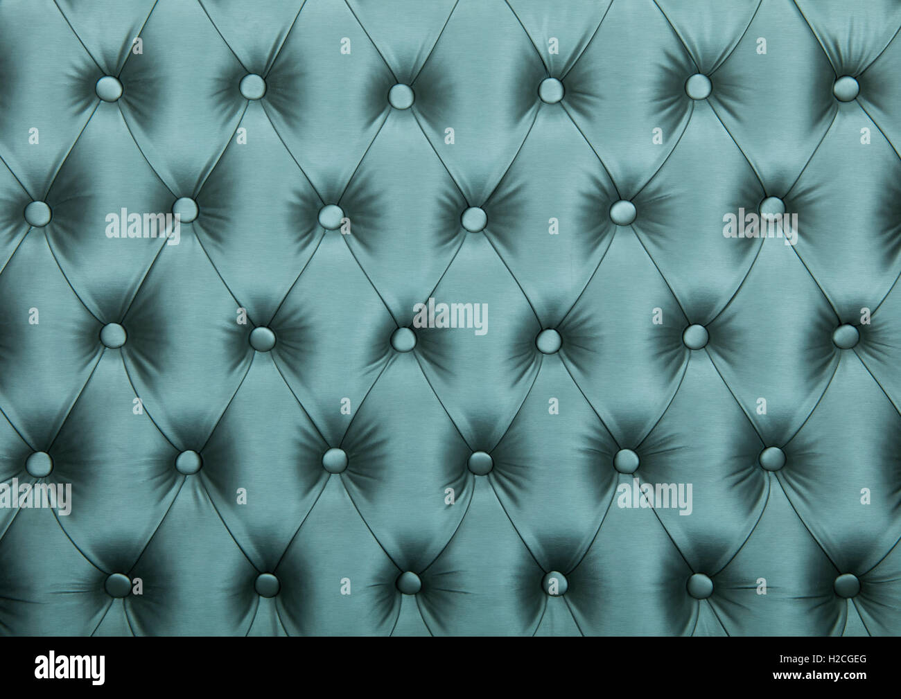Silver blue teal capitone textile background, retro Chesterfield style checkered soft tufted fabric furniture diamond pattern de Stock Photo