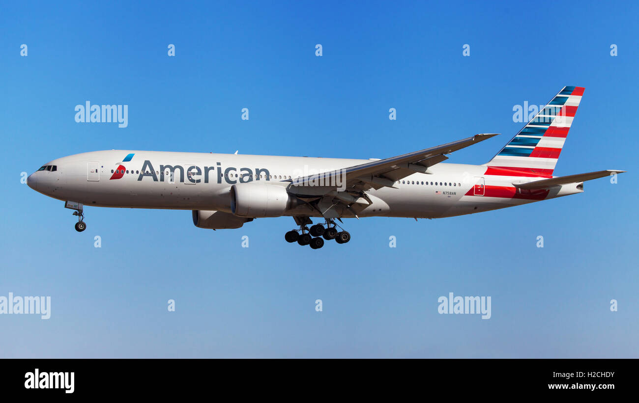 American Airlines Boeing 777-200ER approaching to El Prat Airport in Barcelona, Spain. Stock Photo