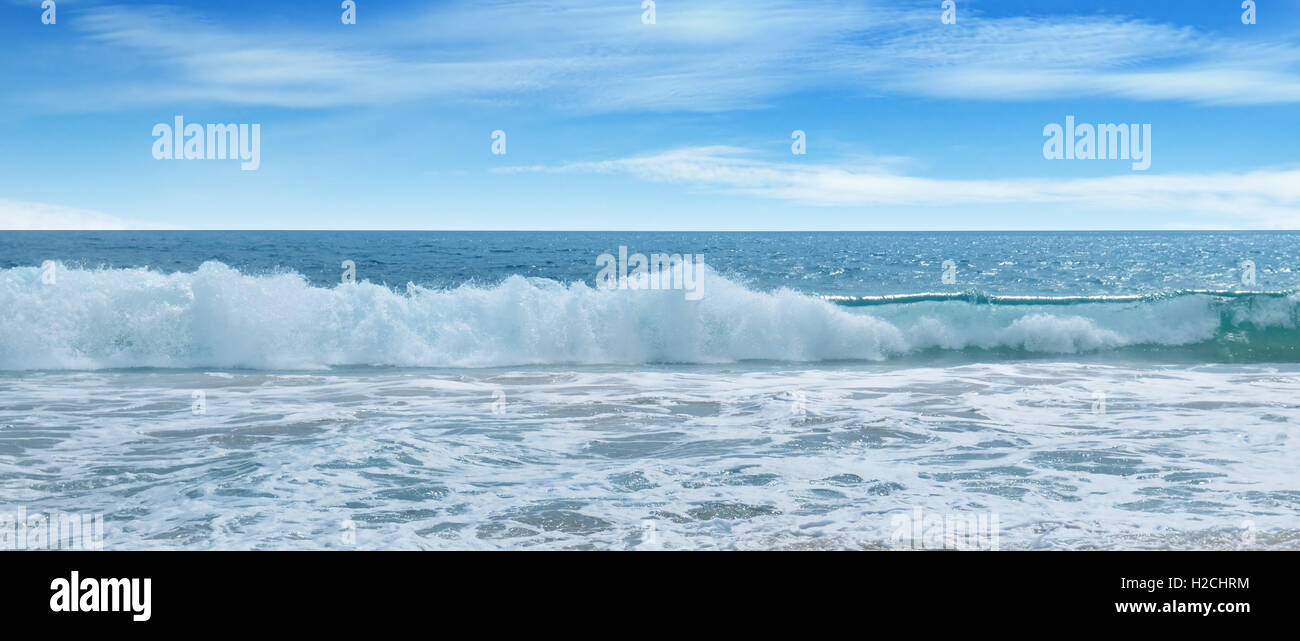 ocean, sandy beach and blue sky Stock Photo - Alamy