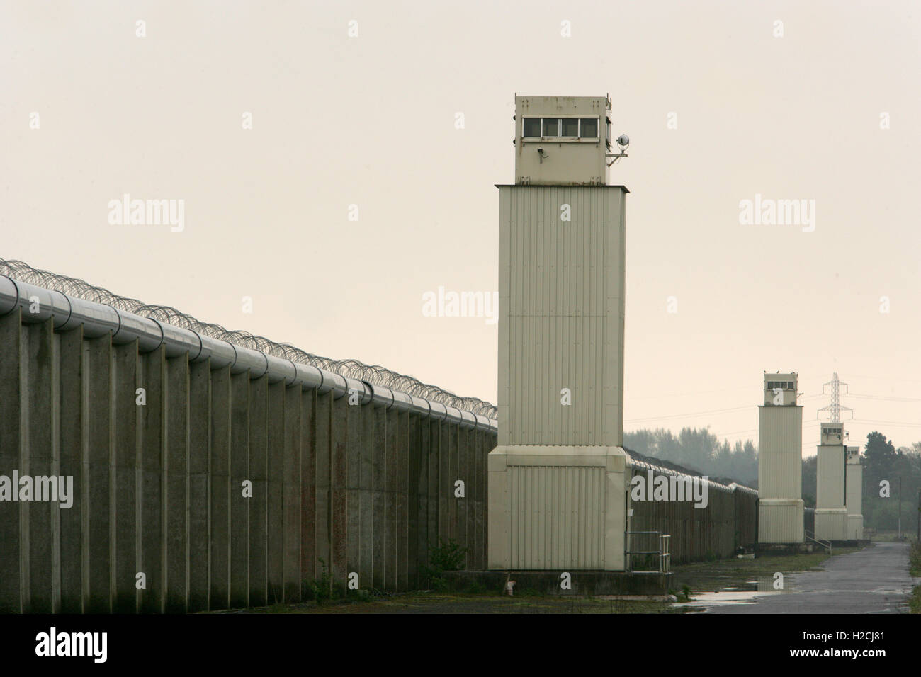 A watchtower and perimeter wall marks the boundary of the former Maze Prison, west of Belfast in Northern Ireland, U.K.  Prison, Stock Photo