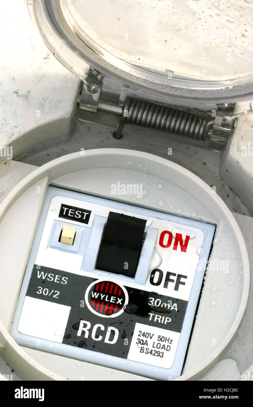 wet discarded electrical safety trip switch Stock Photo