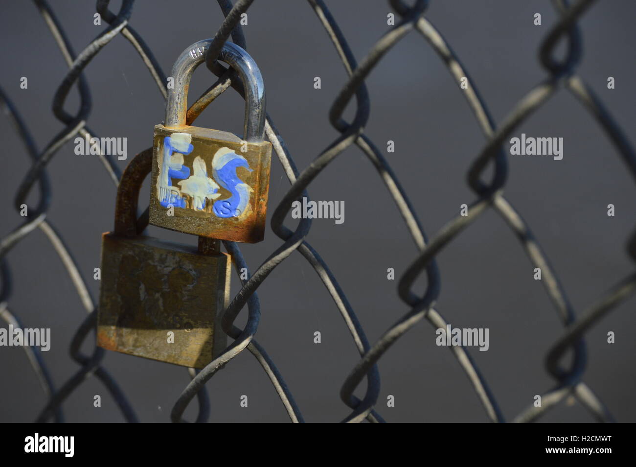 Two Locks on a Chain-link Fence Stock Photo - Alamy
