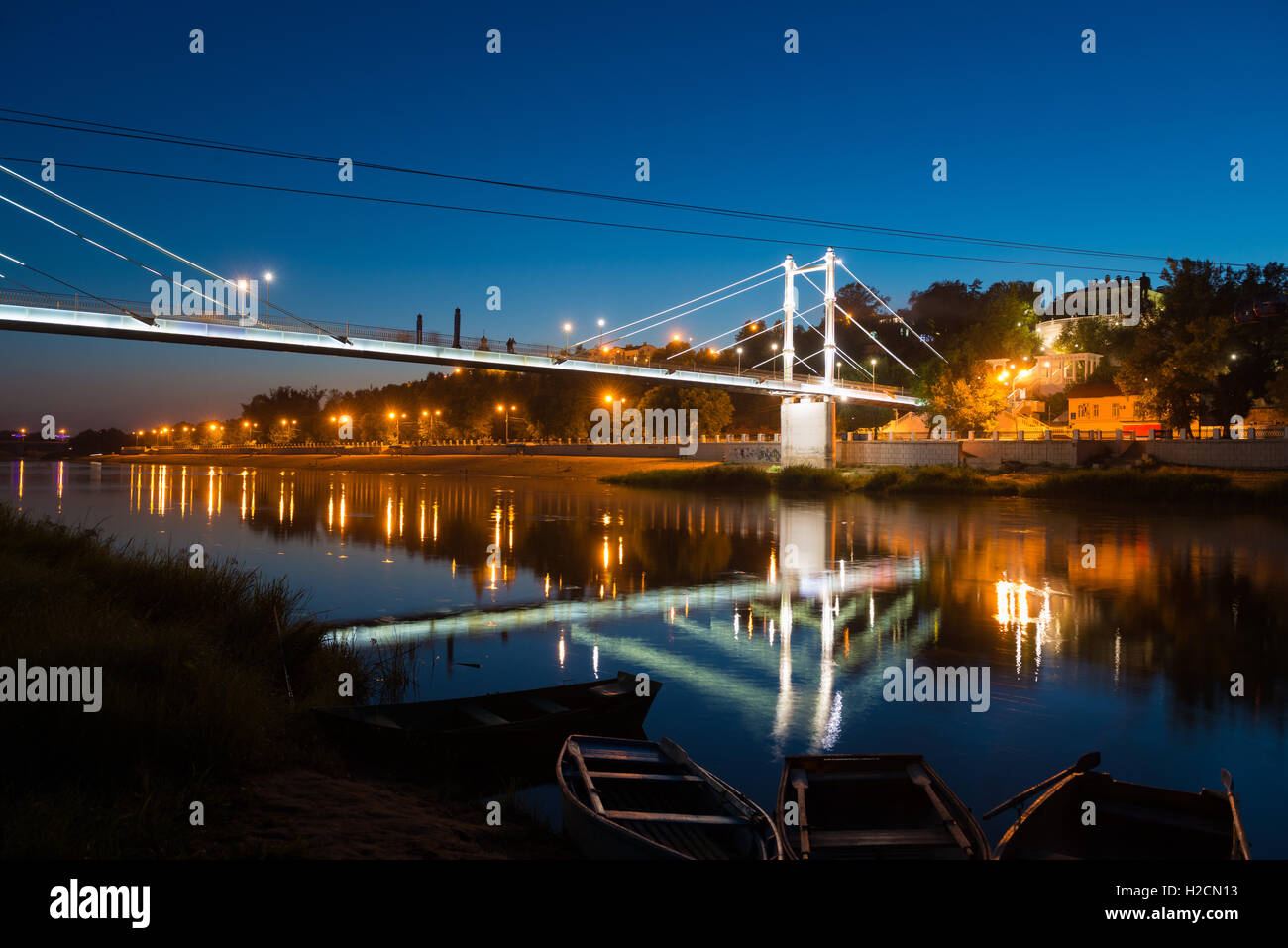 Bridge over the river Ural at night in Orenburg, Russia Stock Photo