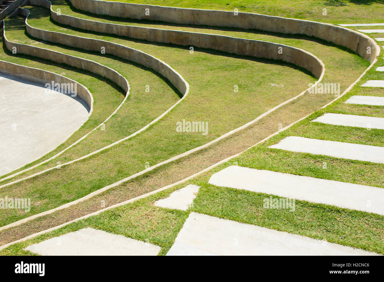 Stone footpath in lawn field. Stock Photo