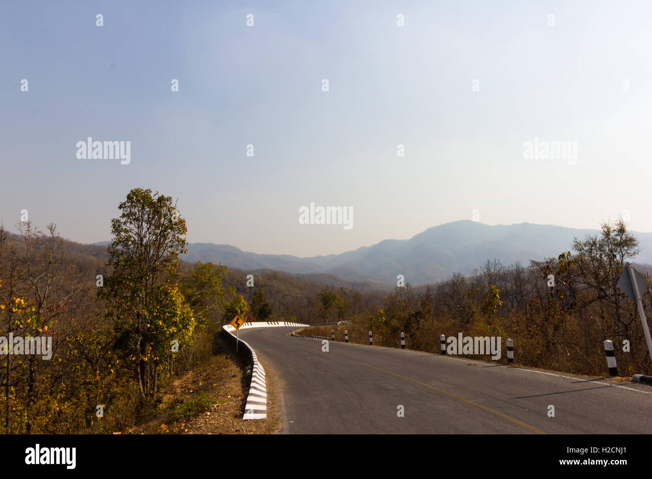 road in the mountains at sunny times Stock Photo