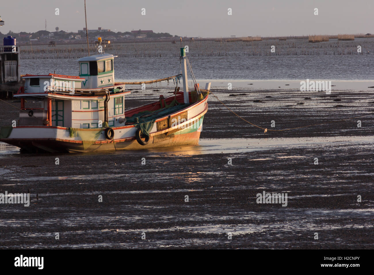 fishing boat on the sea with sunset time Stock Photo - Alamy