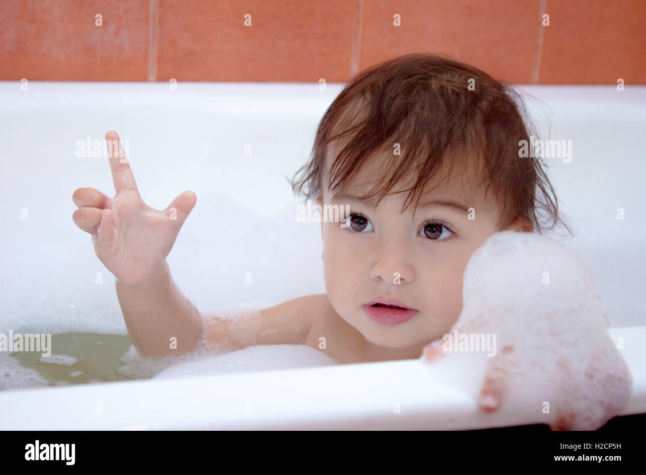 baby is swimming in bath Stock Photo Alamy