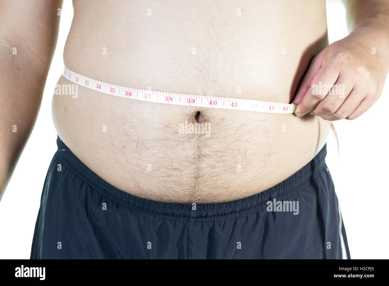 Fat man holding a measuring tape Stock Photo
