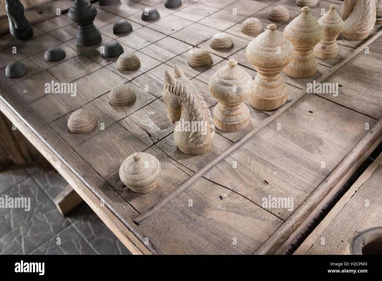 brown chess board with figures on a wooden table in a cafe, playing chess  Stock Photo - Alamy