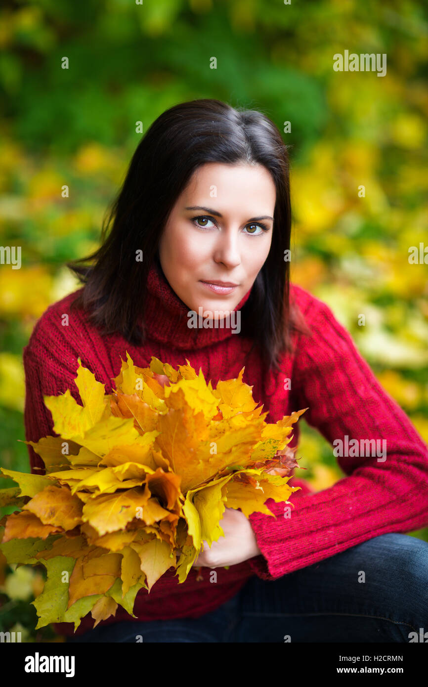Pretty young woman in a colorful autumn park Stock Photo - Alamy