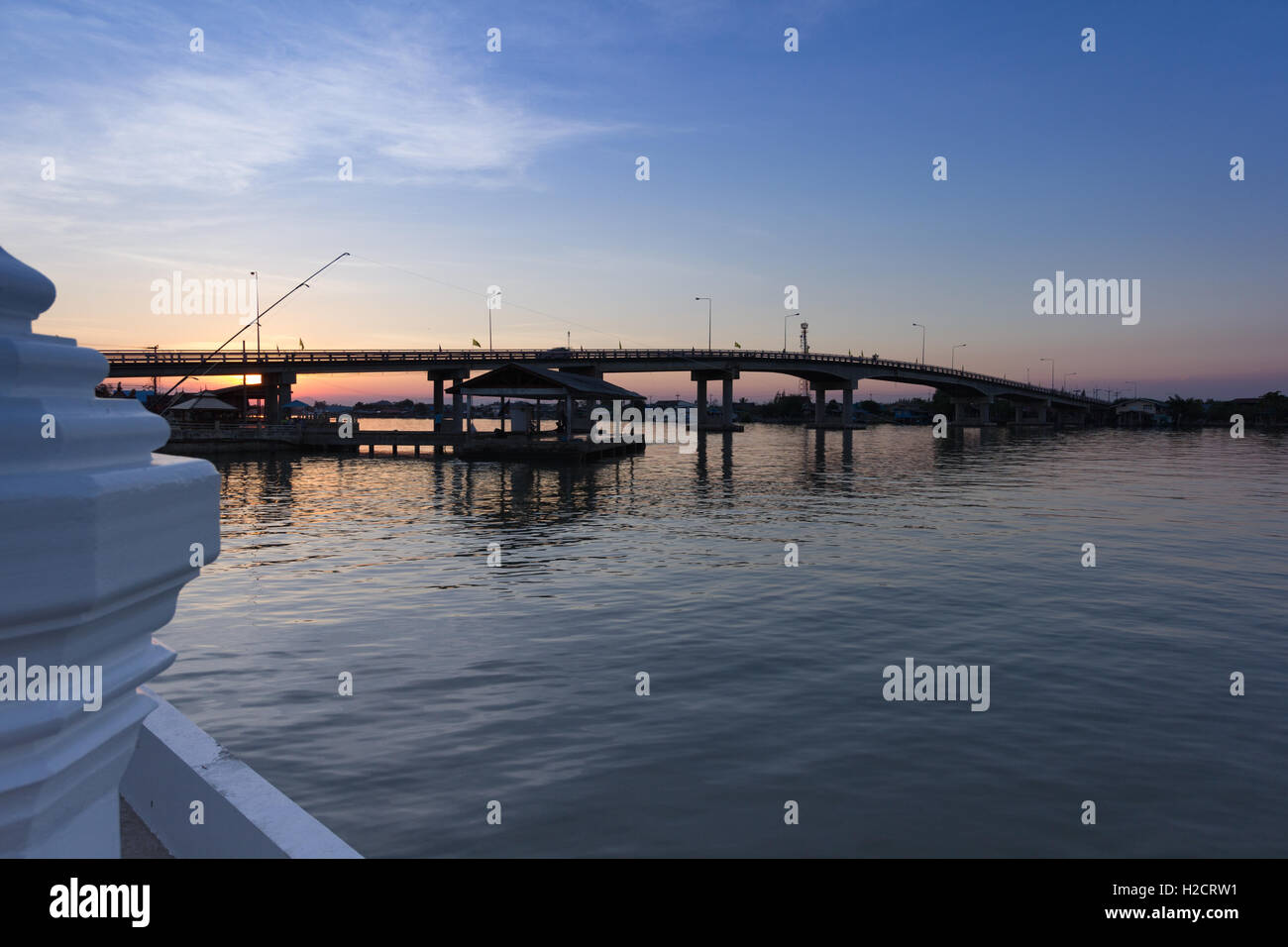 sunset in the sea silhouette bridge and pier Stock Photo - Alamy