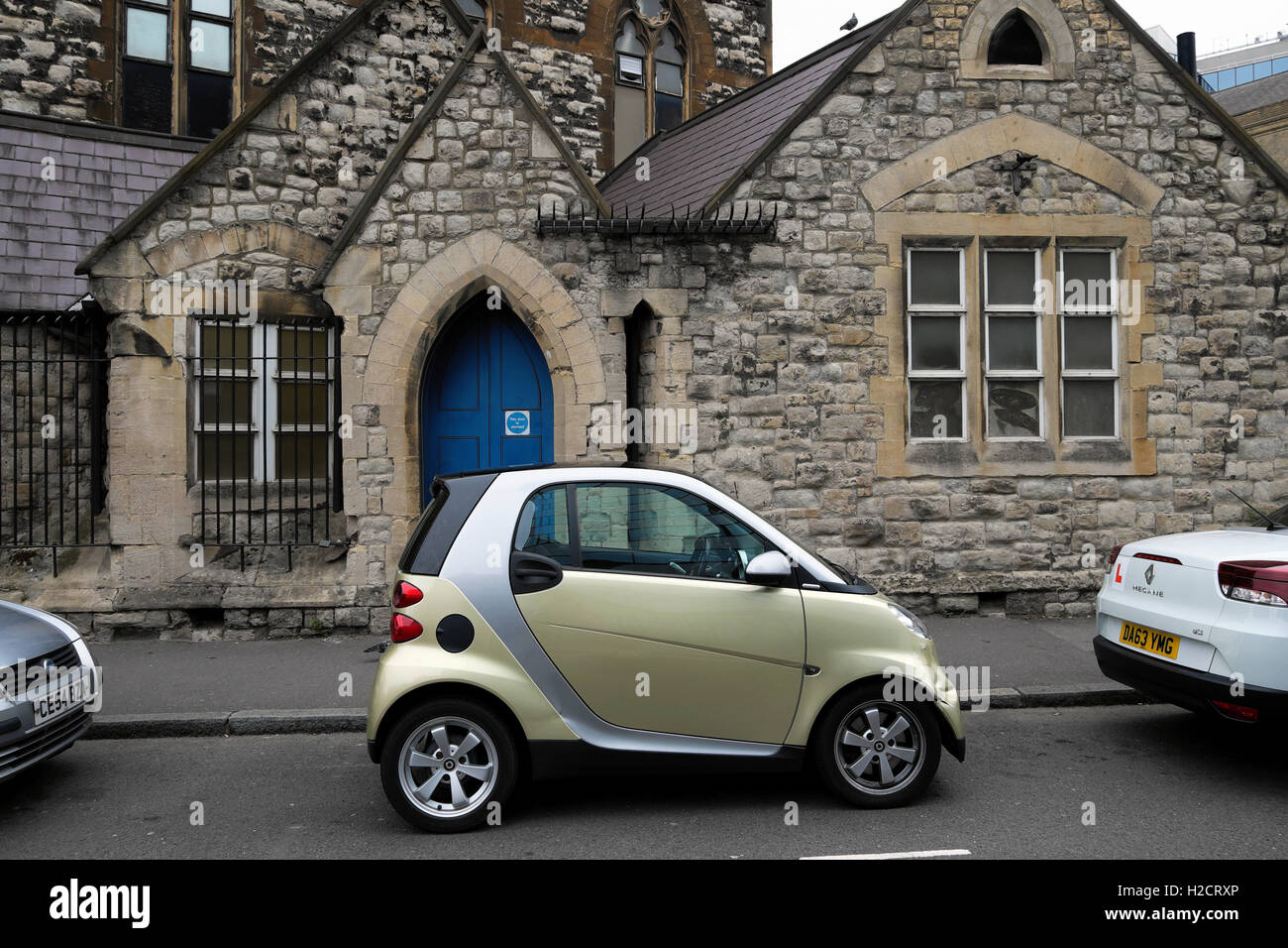 Smart car parked outside Whitefield's Tabernacle Moorfields in Tabernacle Street East London UK Stock Photo