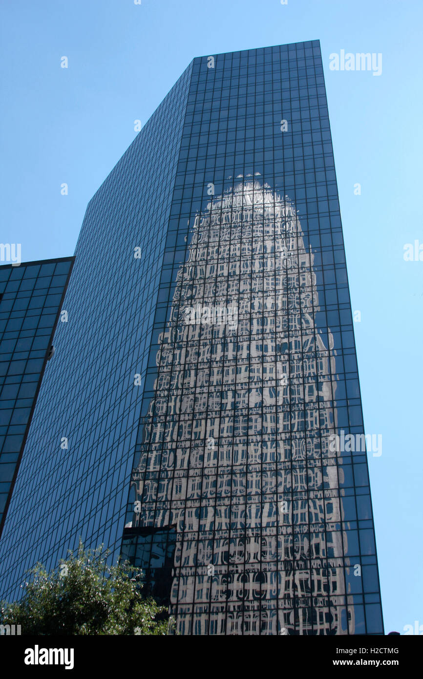 New Bank of America building reflected in old Bank of America building Stock Photo