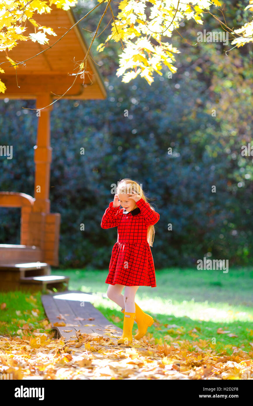 Little girl in autumn park outdoors Stock Photo - Alamy