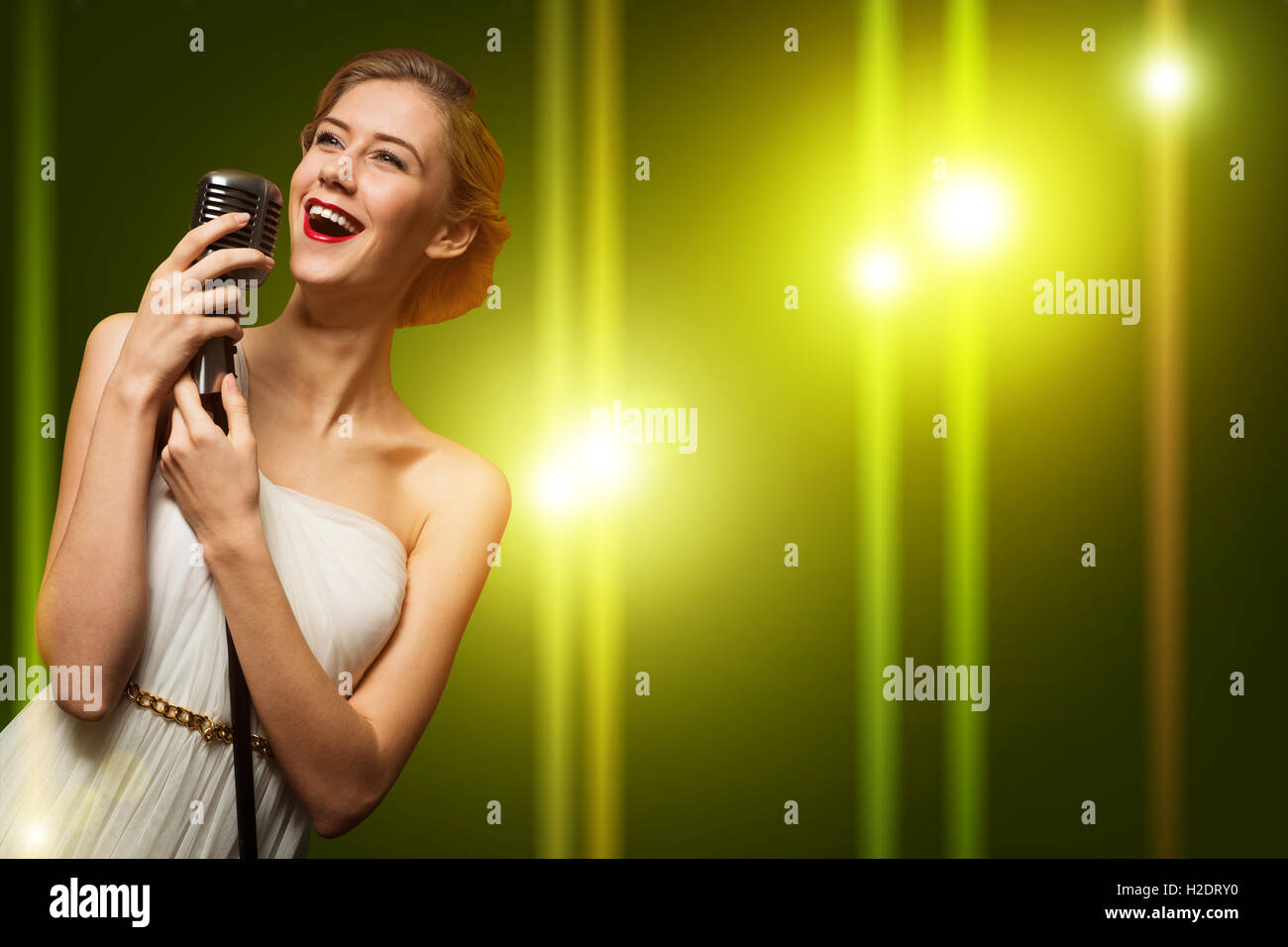 attractive female singer with microphone Stock Photo Alamy