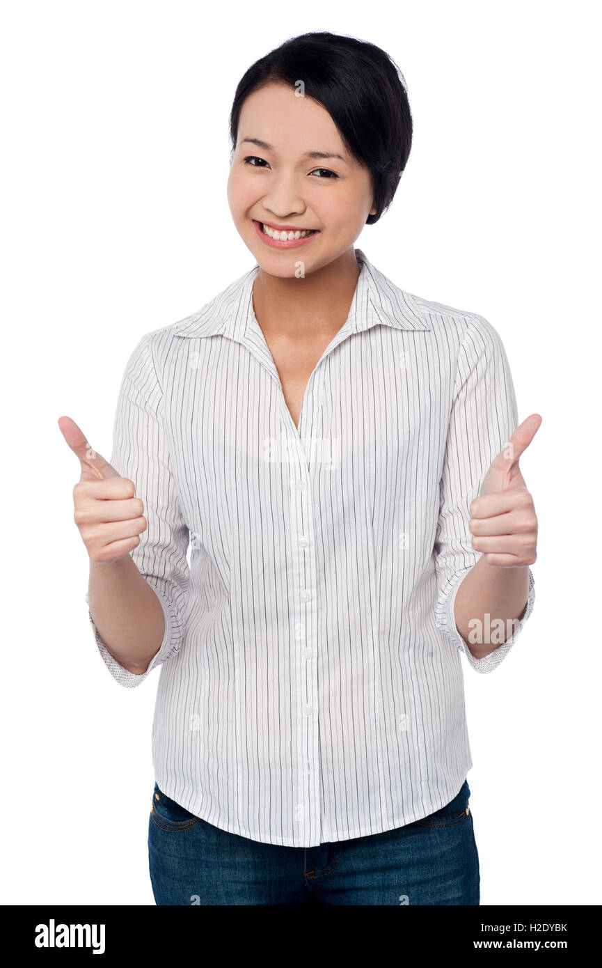Happy beautiful girl giving two thumbs up Stock Photo - Alamy