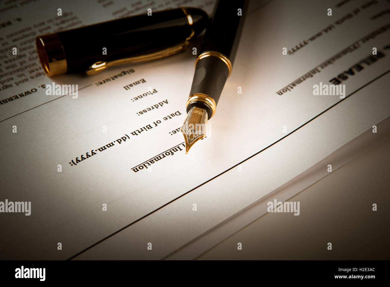 fountain pen on text sheet paper contract Stock Photo - Alamy