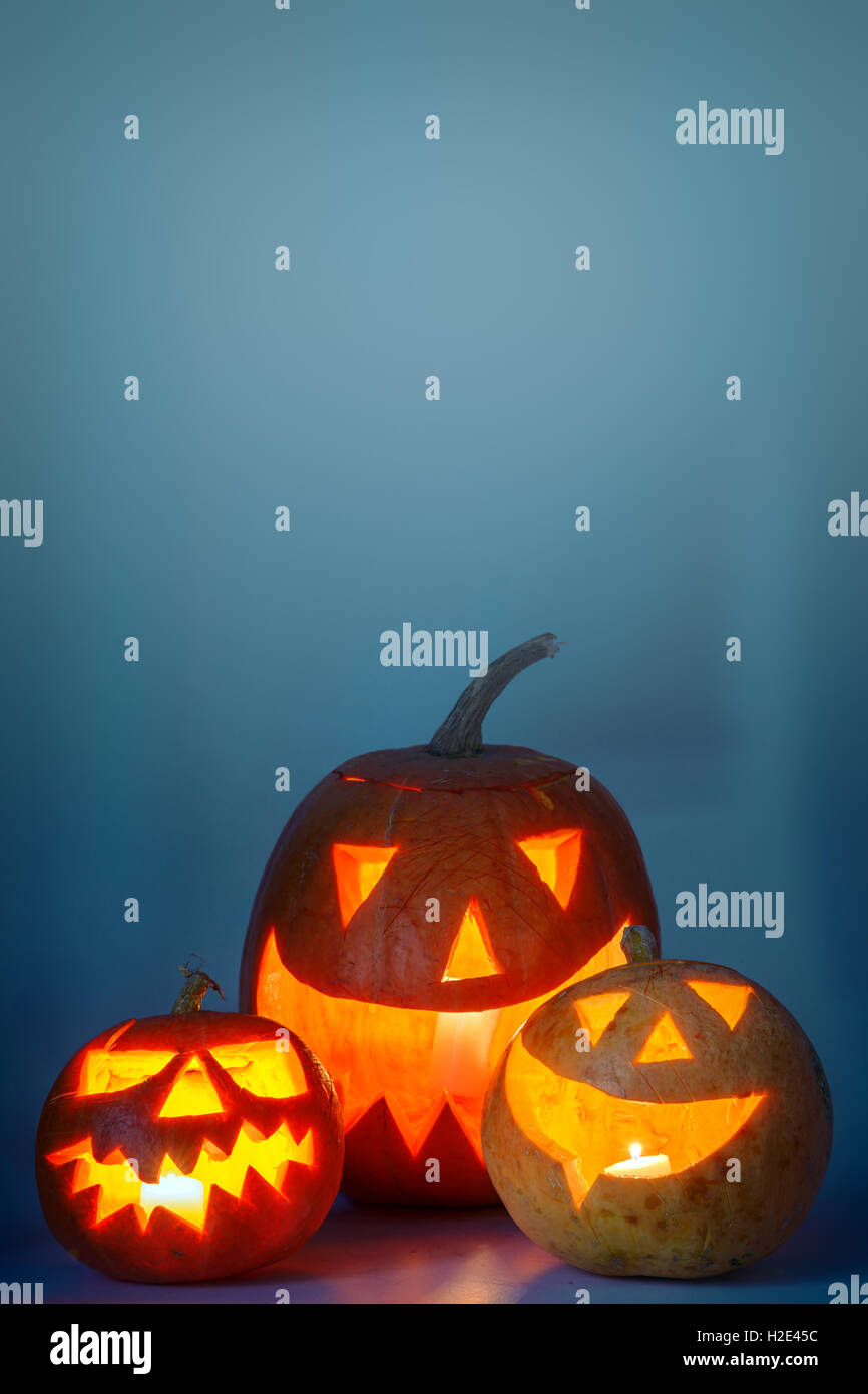 two halloween pumpkin on blue background Stock Photo